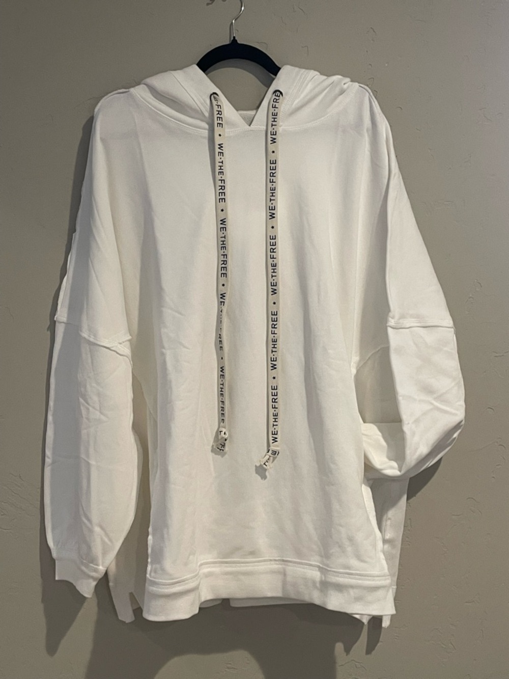 We the Free White oversized drawstring hoody with front pockets.